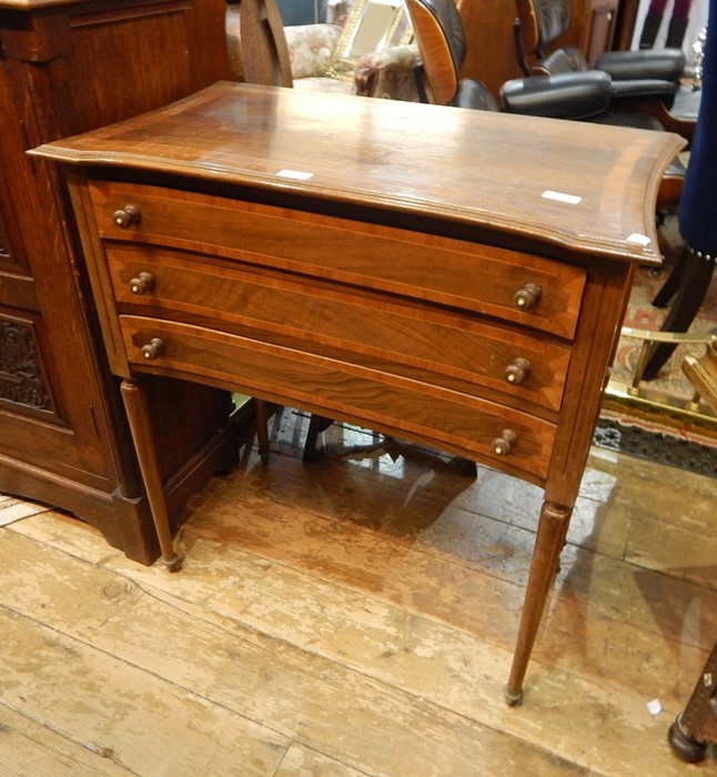 Sheraton style inlaid mahogany chest of three narrow drawers, the top with curved sides and inlaid