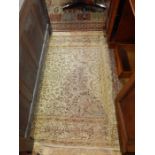 Persian style wool rug, the beige ground allover floral branch decorated with key and floral border,