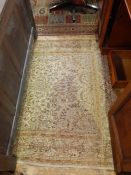 Persian style wool rug, the beige ground allover floral branch decorated with key and floral border,