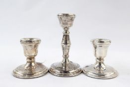 Pair of 20th century silver dumpy candlesticks and a single silver candlestick (3)