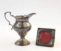 Silver cream jug, London 1921, 10cm high, 3 troy oz (marks rubbed) and a small silver photograph