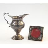 Silver cream jug, London 1921, 10cm high, 3 troy oz (marks rubbed) and a small silver photograph