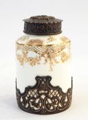 Victorian porcelain bodied jar with gilt decoration, white metal embossed lid with mask to the top