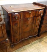 Continental figured walnut serpentine-fronted chest, the top cross-banded with quadrant mould