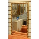 Gilt wall mirror, rectangular with foliate running border, 126cm x 143cm approx overall