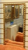 Gilt wall mirror, rectangular with foliate running border, 126cm x 143cm approx overall