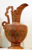 William Schiller & Sons Isnic-style pottery ewer, the red ground with green and gold incised