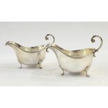 Pair of Walker & Hall revived Georgian-style sauceboats, each oval with free C-scroll handle and
