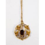 Edwardian 9ct gold, garnet and seedpearl pendant and a gold-coloured ornate fine chain