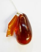 Large polished amber pendant, teardrop shape and another amber pendant (2)