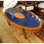 20th century custom made oval coffee table finished in oak, with central oval ostrich skin panel