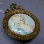 A continental school miniature on ivory portrait of a lady,