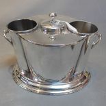 A silver plated two bottle wine cooler with lid for central ice compartment.