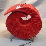 A Pierre Cardin table lamp of spiral form with red fabric covering a metal base, France 1950's.