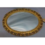 A 20th century giltwood oval wall mirror,