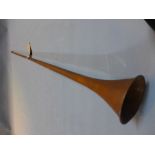 A vintage copper hunting bugle.
