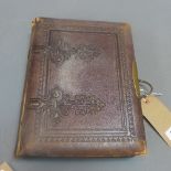 A Victorian leather bound photograph album