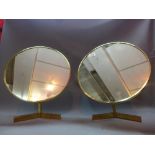 A pair of brass circular table mirrors.