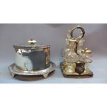 A Walker and Hall silver plated bacon warmer together with a plated cruet stand with cut glass