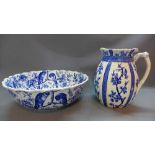 A blue and white english porcelain jug, decorated with blossoming branches,
