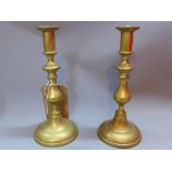 A pair of brass candlesticks.