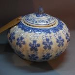 A Chinese Qinglong style blue and white porcelain jar and cover, decorated with flowers,