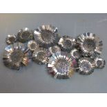 A Contemporary chrome wall hanging sculpture depicting sunflowers, signed and dated 2011, H.
