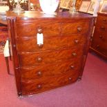 A Regency mahogany chest of two short over four long drawers with gun barrel supports,