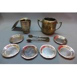 A Mappin and Webb silver mug together with six silver dishes stamped 800 (6oz) and a silver plated