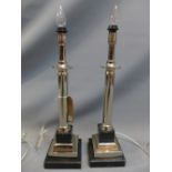 A pair of contemporary chrome and marble table lamps