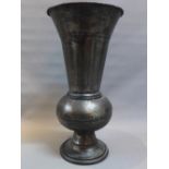 A cast metal baluster vase with everted rim, H.