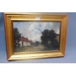 An early 20th century oil on canvas depicting a cottage scene, set in giltwood frame,