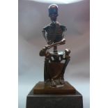 A cast bronze study of a seated skeleton, raised on a marble base, signed 'Milo', H.