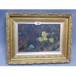An early 20th century oil on canvas depicting flowers set in giltwood frame,