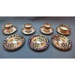 A collection of Crown Derby Imari porcelain, including three small cups and four saucers, 1877-90,
