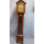 An early to mid 18th century oak longcase clock, the arched brass dial with Roman numerals, the case