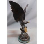 Cast bronze study of an Eagle perched on a branch, bears signature for Jules Moigniez, raised on