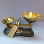 A set of J & J. Siddons kitchen scales, with five weights