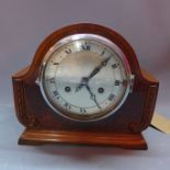 A mahogany and walnut cased 14 day mantel clock, made in Baden, the silvered dial with Roman