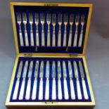 A cased set of mother of pearl handled silver knives and forks, the blades hallmarked Sheffield.