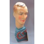 A 1930's Art Deco cast plaster bust of a young man, raised on base marked 'City Sport', H. 54cm