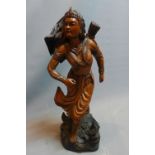 A 20th Century carved oak statue of a female warrior. H-69cm