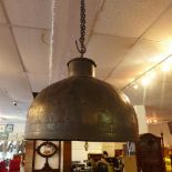 A large industrial ceiling light shade