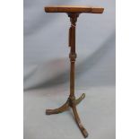 A late 19th century mahogany lamp stand with reeded support raised on three splayed legs. H-95cm