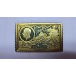 A gold plated replica £1 postage stamp, the obverse bearing George V and Britannia on a chariot in