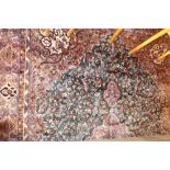 A green ground Persian carpet. 280cm x 180cm