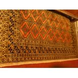 An Afghan Rug with geometric patterns, signed 120cm x 85cm