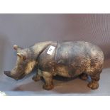 A Ceramic rhino, H: 50cm L: 44cm