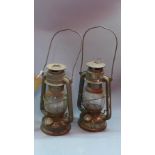 A pair of early 20th century miners oil lamps