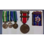 A collection of medals, to include a LCC King's Medal, the obverse with George V, the reverse with